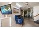 Spacious basement with a recliner and TV at 18 Winston Dr, Belleair, FL 33756