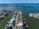 Aerial view of waterfront homes with private docks and boat access at 18 Winston Dr, Belleair, FL 33756