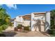 Two-story home with circular columns and terracotta roof at 18 Winston Dr, Belleair, FL 33756