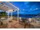 Elegant pergola overlooking the water with seating at 18 Winston Dr, Belleair, FL 33756