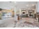 Kitchen undergoing renovation, features exposed pipes and damaged flooring at 1840 Venetian Point Dr, Clearwater, FL 33755