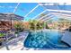 Inviting screened pool with lush landscaping at 19104 Redbay Way, Tampa, FL 33647