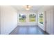 Bright sunroom with tile flooring and backyard access at 25434 Colon Dr, Punta Gorda, FL 33983