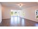 Spacious living area with tile floors and access to a sunroom at 25434 Colon Dr, Punta Gorda, FL 33983