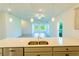 Modern kitchen with gray cabinets, quartz countertops, and stainless steel appliances at 25434 Colon Dr, Punta Gorda, FL 33983