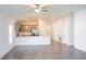 Open living room with tile flooring and a view into the kitchen at 25434 Colon Dr, Punta Gorda, FL 33983