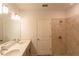 Bathroom with double vanity, walk-in shower, and tile flooring at 25434 Colon Dr, Punta Gorda, FL 33983