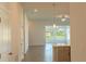 Bright living room with tile flooring and access to backyard at 25434 Colon Dr, Punta Gorda, FL 33983