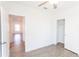 Bedroom with double door closet and ceiling fan at 25434 Colon Dr, Punta Gorda, FL 33983