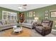 Comfortable living room with light gray sofas and a recliner at 2939 Yucca Ct, Palm Harbor, FL 34684