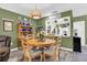 Charming dining area with a wooden table and chairs, great for Gathering meals at 2939 Yucca Ct, Palm Harbor, FL 34684