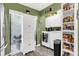 Convenient laundry room with washer, dryer, and ample storage space at 2939 Yucca Ct, Palm Harbor, FL 34684