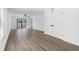 Bright living room with vinyl plank flooring and sliding glass doors at 29634 Fedora Cir, Brooksville, FL 34602