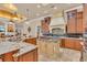 Island kitchen with granite counters and custom cabinetry at 4907 Londonderry Dr, Tampa, FL 33647