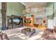Spacious living room with high ceilings, a spiral staircase, and a large entertainment center at 4907 Londonderry Dr, Tampa, FL 33647