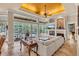 Spacious living room with pool view, fireplace and high ceilings at 4907 Londonderry Dr, Tampa, FL 33647