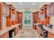 Home office with built-in cabinetry and granite countertops at 4907 Londonderry Dr, Tampa, FL 33647