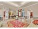 Open dining room and living area with a raised floor and access to the kitchen at 4907 Londonderry Dr, Tampa, FL 33647