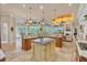 Open kitchen with large island and views into living room at 4907 Londonderry Dr, Tampa, FL 33647