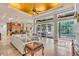 Spacious living room with high ceilings, fireplace, and pool view at 4907 Londonderry Dr, Tampa, FL 33647