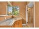Elegant bathroom with granite countertops and a glass shower at 4907 Londonderry Dr, Tampa, FL 33647
