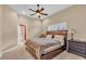 Bright bedroom with a king-size bed and an attached bathroom at 4907 Londonderry Dr, Tampa, FL 33647