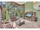 Gathering room with high ceilings and expansive windows at 4907 Londonderry Dr, Tampa, FL 33647