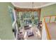 Two story living room with large windows and ample natural light at 4907 Londonderry Dr, Tampa, FL 33647