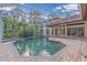 Inviting screened pool and patio area with brick pavers at 4907 Londonderry Dr, Tampa, FL 33647