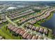 An aerial view of the community homes with ponds, landscaping and streets from a Primary planned neighborhood at 5721 Sunset Falls Dr, Apollo Beach, FL 33572