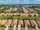Gorgeous aerial view of the homes and neighborhood with mature trees and landscaping at 5721 Sunset Falls Dr, Apollo Beach, FL 33572