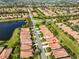 Aerial view of a quiet community with mature trees and landscaping at 5721 Sunset Falls Dr, Apollo Beach, FL 33572