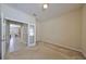 A bright bedroom features neutral carpeting and fresh neutral paint at 5721 Sunset Falls Dr, Apollo Beach, FL 33572