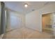 A well-lit bedroom is shown with neutral walls, carpet, and a large, white closet at 5721 Sunset Falls Dr, Apollo Beach, FL 33572