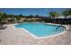 Inviting community pool with ample deck space and lounge chairs at 5721 Sunset Falls Dr, Apollo Beach, FL 33572