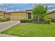 Charming single-story home featuring a well-manicured lawn and a classic tile roof at 5721 Sunset Falls Dr, Apollo Beach, FL 33572