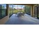 Relaxing screened-in lanai with an outdoor dining area and scenic backyard views at 5721 Sunset Falls Dr, Apollo Beach, FL 33572