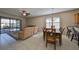 Bright living room with a dining area, comfortable seating, and access to the outdoor patio at 5721 Sunset Falls Dr, Apollo Beach, FL 33572