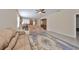 Spacious living room featuring neutral paint, tile floors, area rug, and an open floor plan for easy entertaining at 5721 Sunset Falls Dr, Apollo Beach, FL 33572