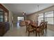 Open concept living and dining area with natural light, perfect for Gathering gatherings at 5721 Sunset Falls Dr, Apollo Beach, FL 33572