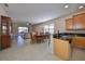 Open-concept living space with tile floors, connecting kitchen, dining, and living areas at 5721 Sunset Falls Dr, Apollo Beach, FL 33572