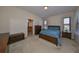 Comfortable main bedroom with ample natural light, and access to the main bathroom at 5721 Sunset Falls Dr, Apollo Beach, FL 33572