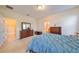 Comfortable main bedroom with ample natural light, and access to a walk-in closet and the main bathroom at 5721 Sunset Falls Dr, Apollo Beach, FL 33572
