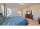 Comfortable main bedroom with ample natural light, and access to another room and the main bathroom at 5721 Sunset Falls Dr, Apollo Beach, FL 33572
