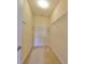 Walk-in closet with carpet floors and a wall-mounted wire shelving system for optimal storage and organization at 5721 Sunset Falls Dr, Apollo Beach, FL 33572