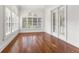 Bright bedroom with hardwood floors and plantation shutters at 6515 Stonington S Dr, Tampa, FL 33647