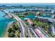 Aerial view of a waterfront community with a bridge and beautiful ocean views at 7625 Sun Island S Dr # 305, South Pasadena, FL 33707