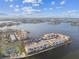 Aerial view of waterfront community with tennis courts and boat slips at 7625 Sun Island S Dr # 305, South Pasadena, FL 33707