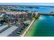 Drone view of waterfront condo building, pool, and parking at 7625 Sun Island S Dr # 305, South Pasadena, FL 33707