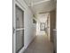 Clean and well-lit hallway leading to condo units at 7625 Sun Island S Dr # 305, South Pasadena, FL 33707